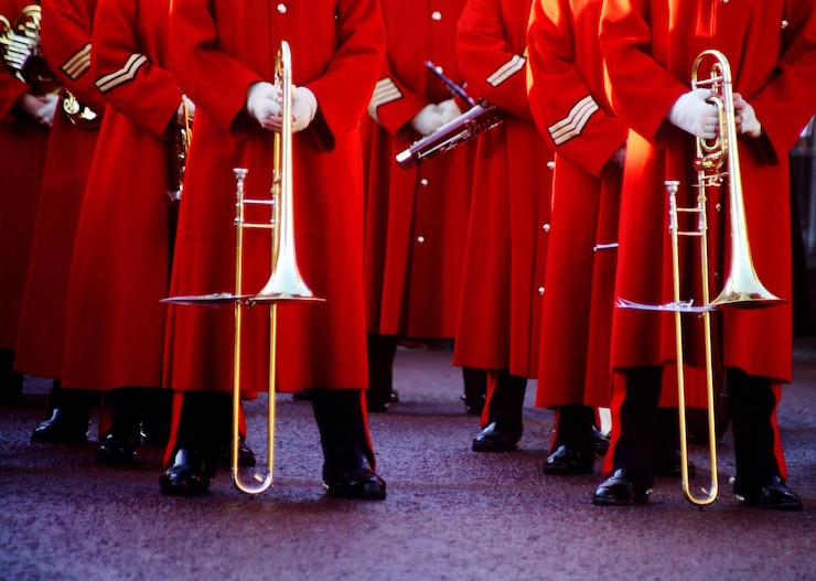 फोटो low section of army soldiers wearing red uniform during parade