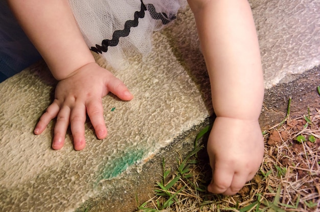 Low section of child playing on rug