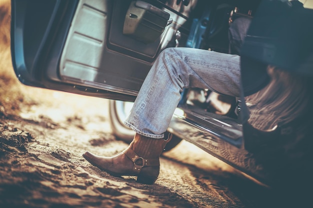 Photo low section of man in car