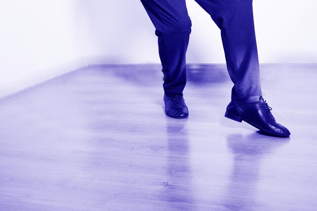 Low section of man dancing on floor