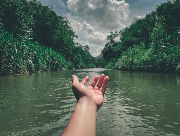 Low section of man holding water