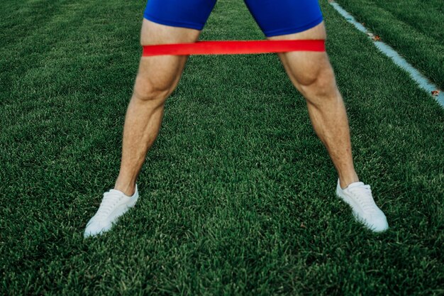 Photo low section of man running on grass