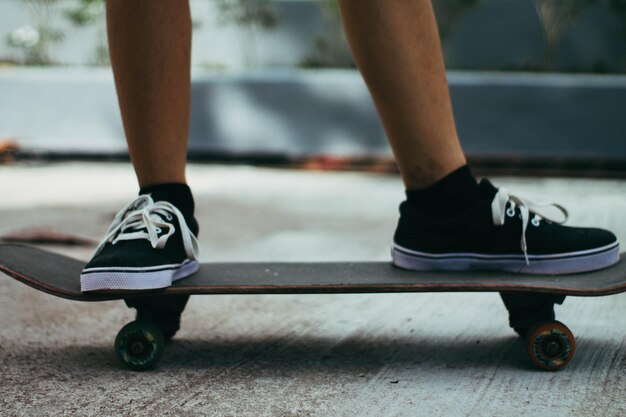 Low section of man skateboarding