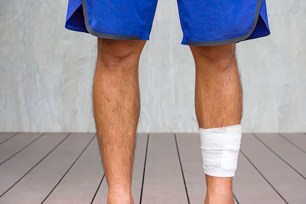 low section of man standing on footpath