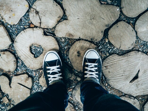 Low section of man standing on footpath