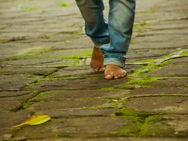 Low section of man standing outdoors