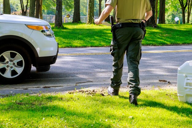 Low section of man standing on road