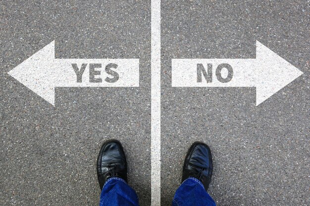 Low section of man standing on road