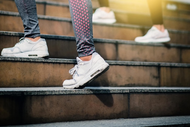 Low section of man standing on staircase