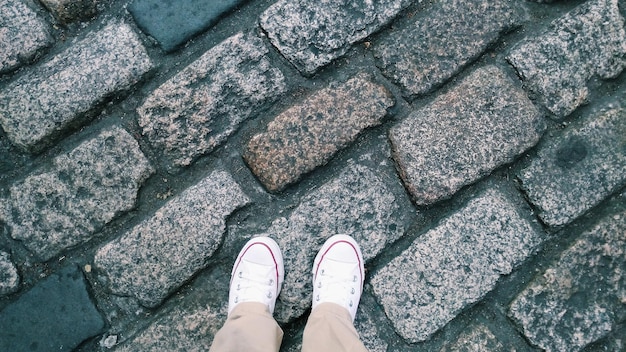 Low section of man standing on street