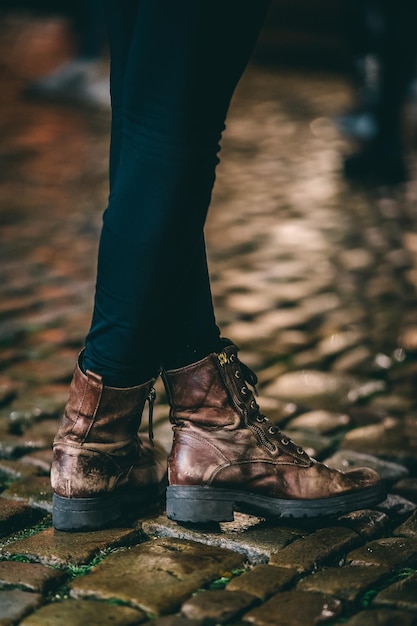 Low section of man standing on street