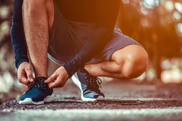 Low section of man with baby feet