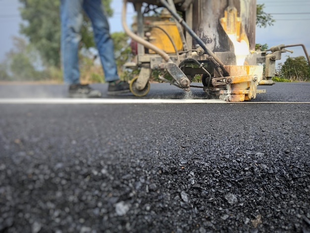 Photo low section of man working on road in city