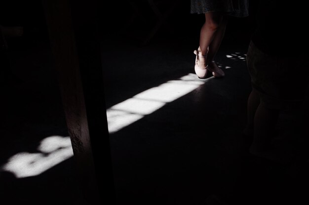 Low section of people in dark room
