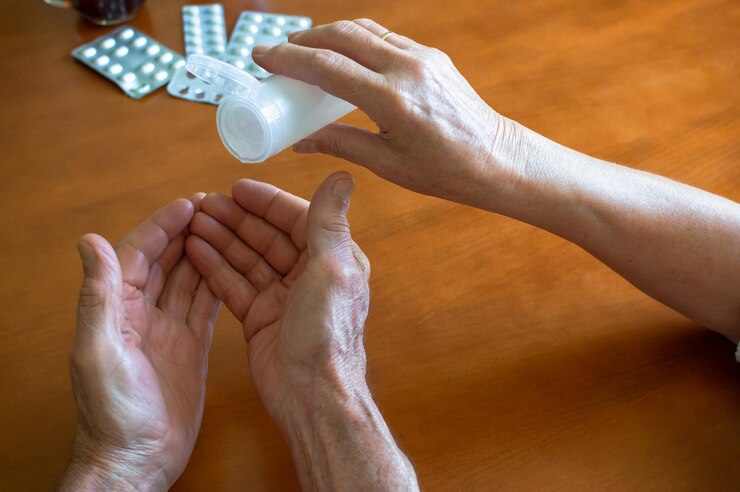 Photo low section of people holding hands on table