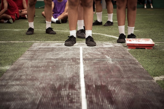 Low section of people playing at field