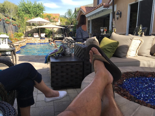 Low section of people relaxing by the pool