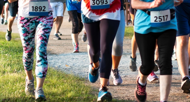 Photo low section of people running on land