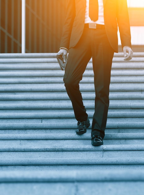 Photo low section of people walking on staircase