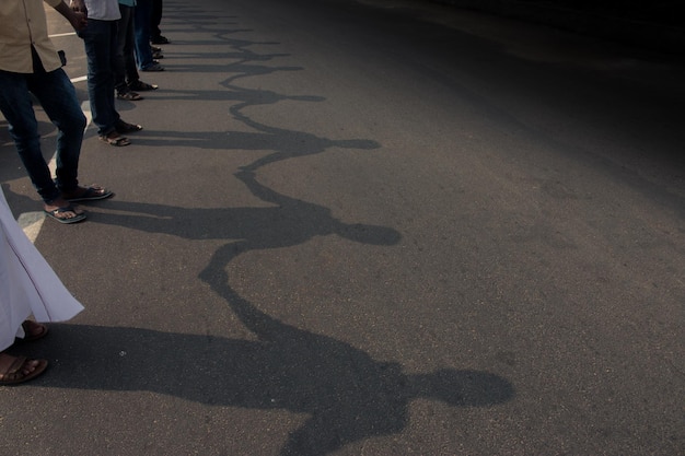 Low section of people walking on street