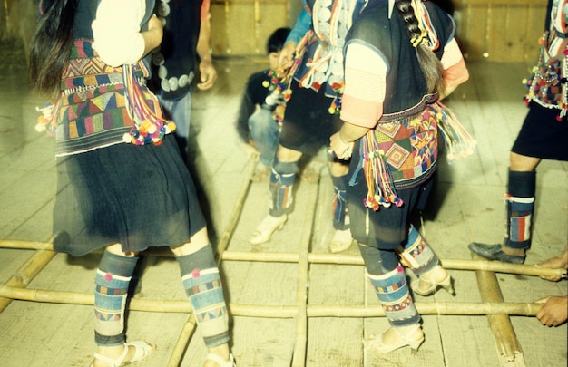 Low section of people walking on street