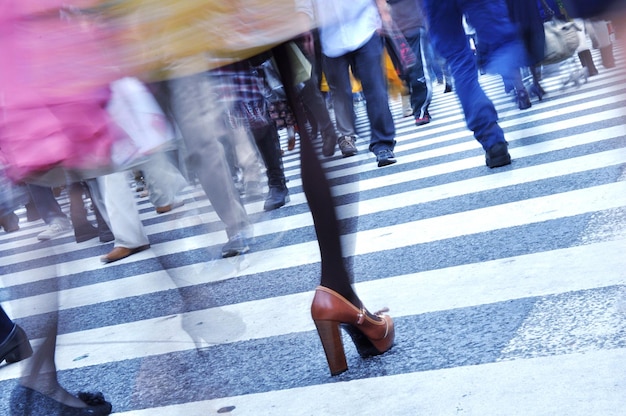 Photo low section of people walking on street