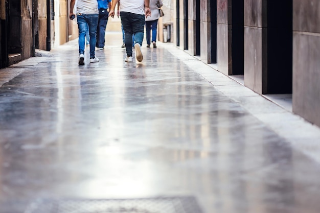 low section of people walking on walkway