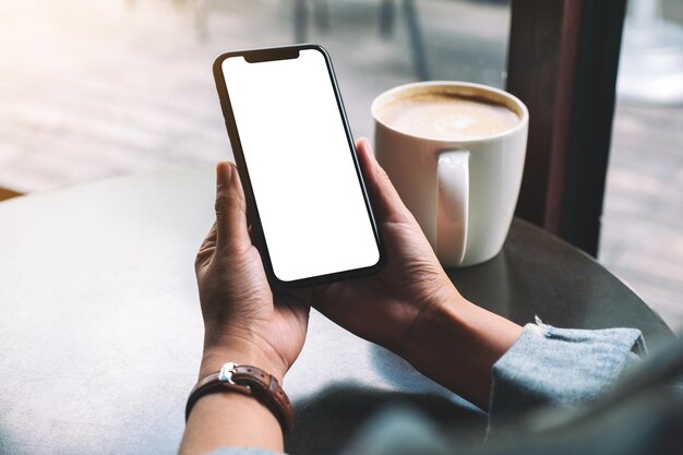 Photo low section of person holding coffee cup