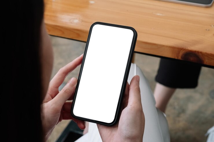 Photo 携帯電話を握っている人の下側