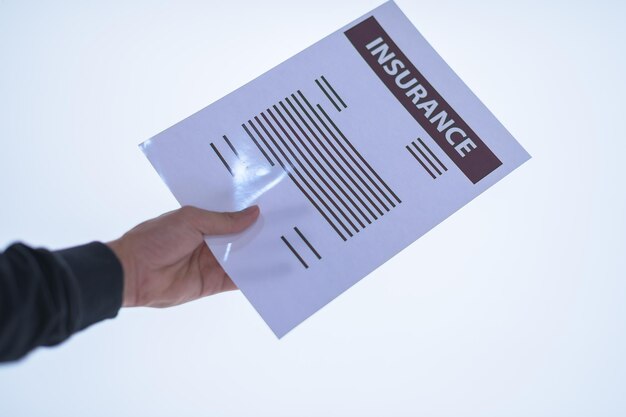 Photo low section of person holding paper against white background