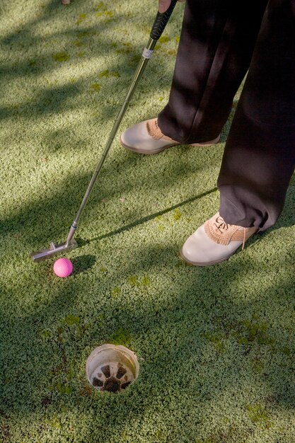 Photo low section of person playing golf