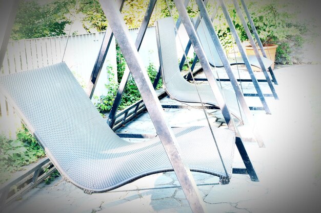 Low section of person relaxing on hammock