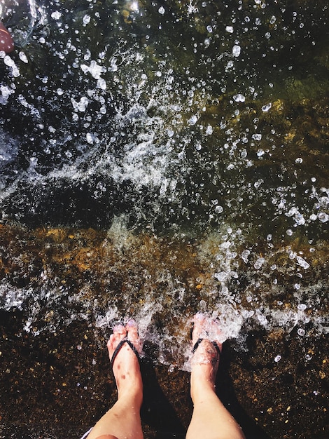 Low section of person in sea