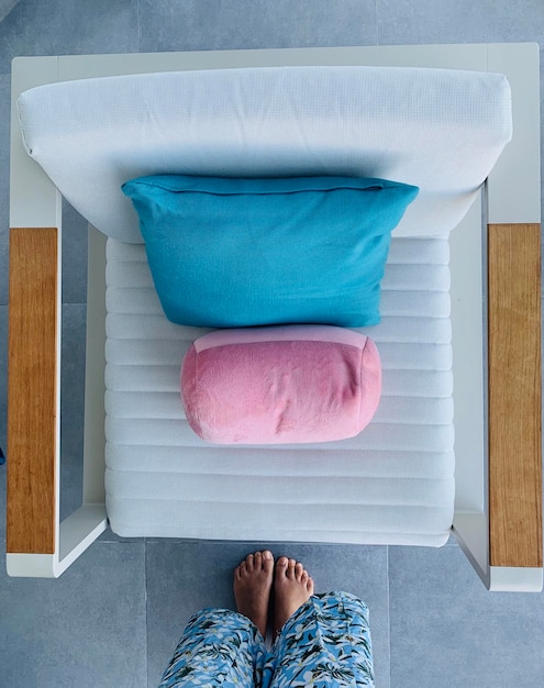 Photo low section of person standing by seat at home