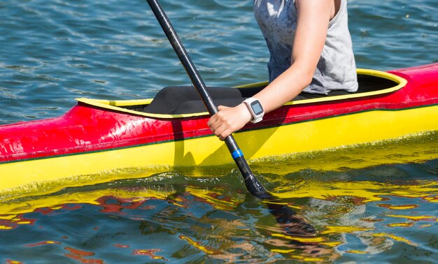 Low section of person standing on lake