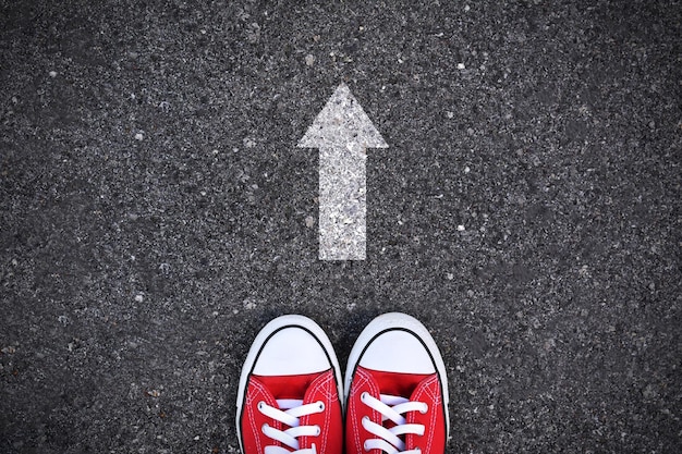 Low section of person standing on road