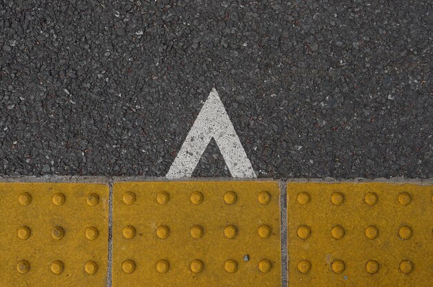 Photo low section of person standing on road