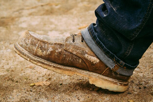 Photo low section of person wearing shoes