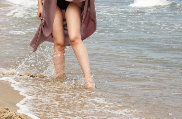 Low section of woman on beach