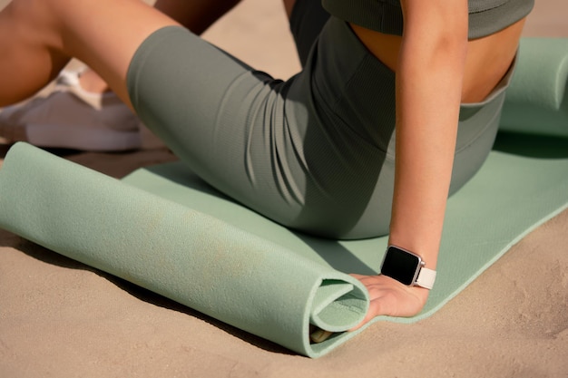 Low section of woman doing yoga