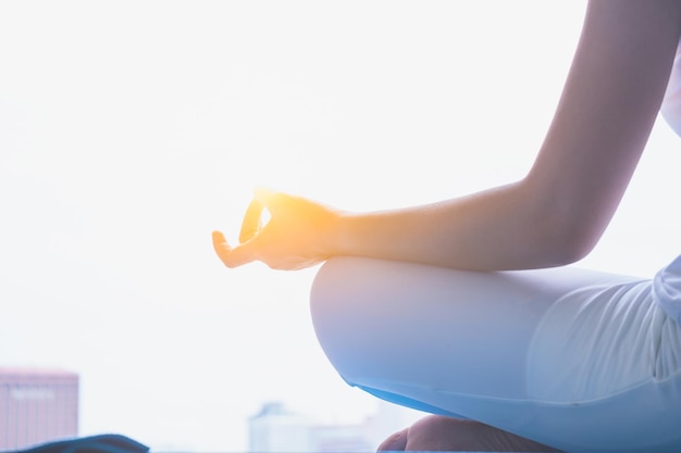 low section of woman doing yoga