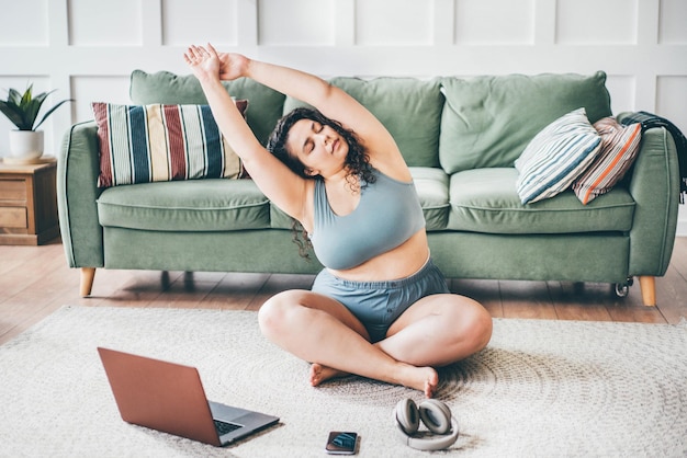 Low section of woman exercising at home