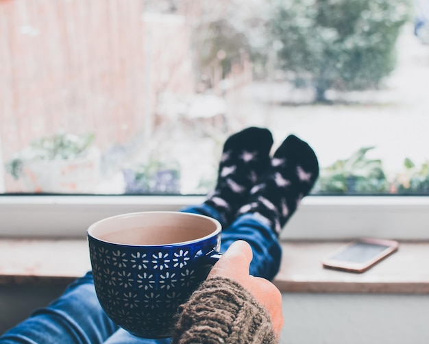 Photo low section of woman having coffee at home