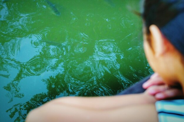 Low section of woman legs in water