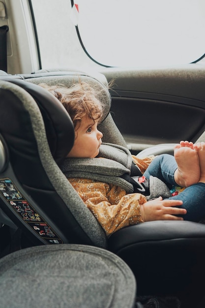 Low section of woman sitting in car