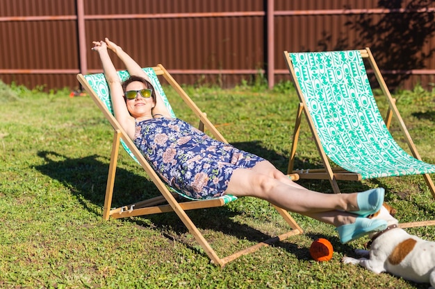 Low section of woman sitting on grass