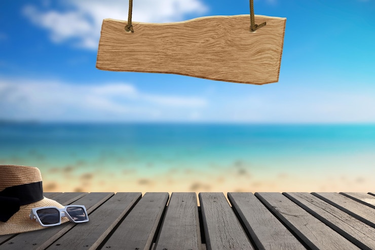 Photo low section of woman sitting on pier at beach