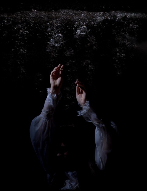 Photo low section of woman standing against black background