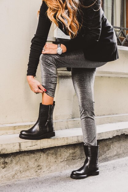 Low section of woman standing outdoors