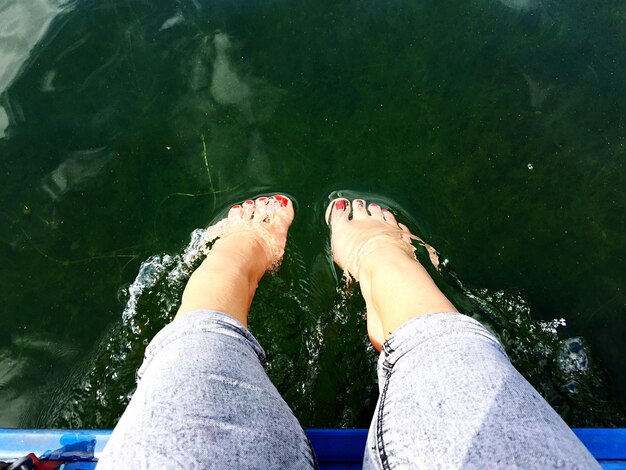 Photo low section of woman in water outdoors